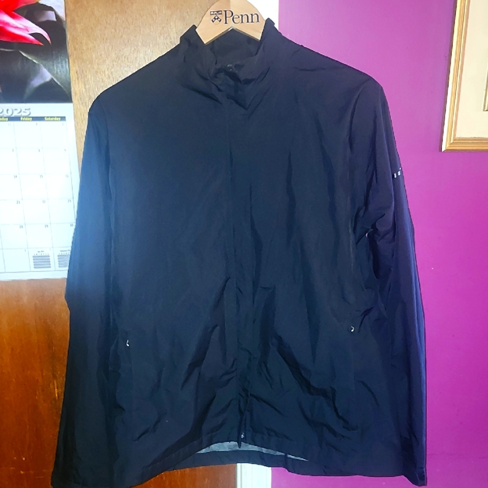 Nike Womens Golf Black Storm Fit Waterproof Windbreaker Jacket.